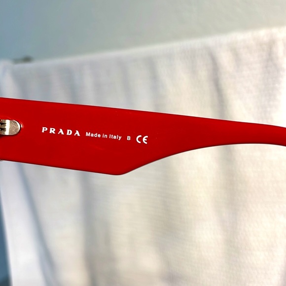 New authentic Prada sunglasses in red with blue stones. main image 4
